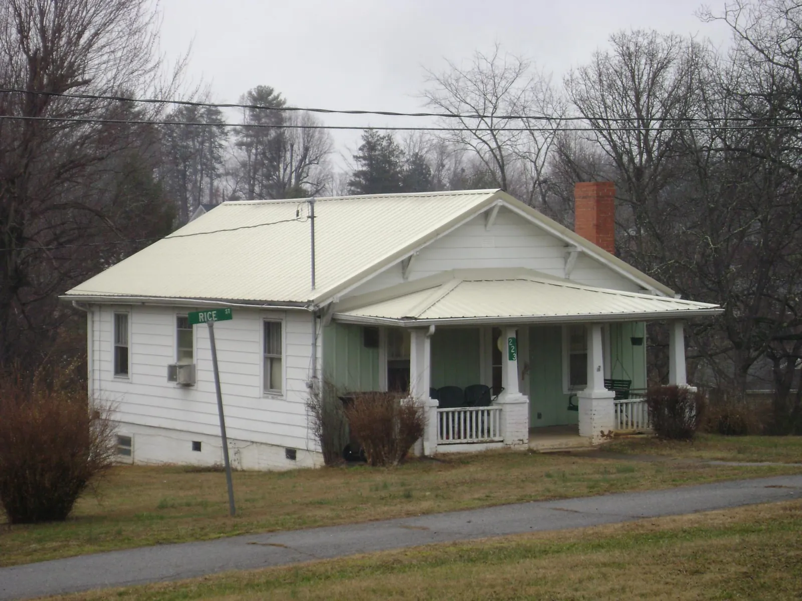 White metal roof on a craftsman bungalow at a street corner in Penn Yan